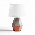 Geometric table lamp with fabric shade and ceramic base in peach and gray